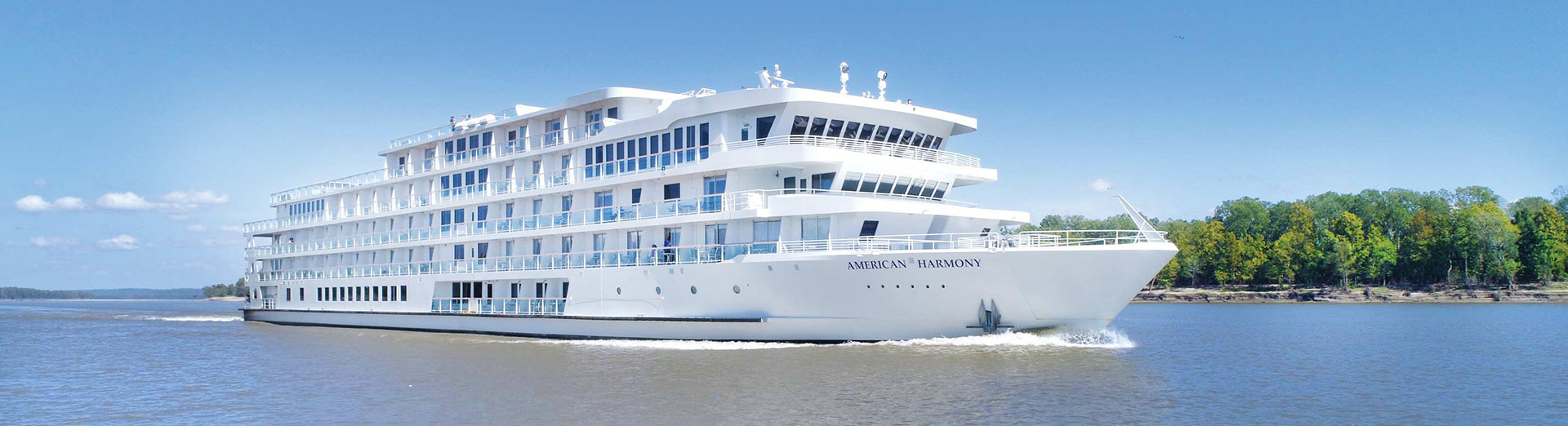 Modern five-deck American riverboat under way on a calm river